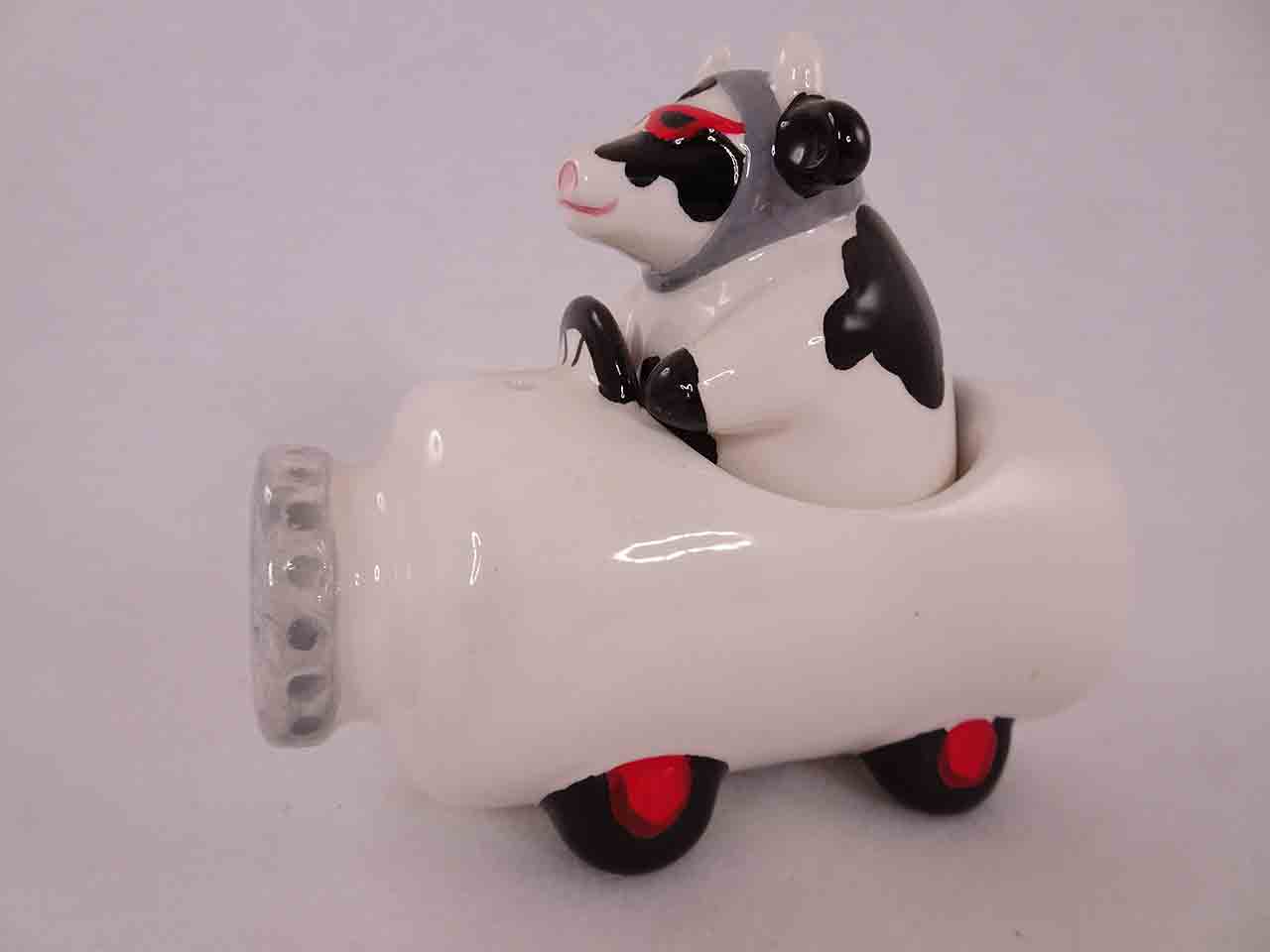 Clay Art salt and pepper shakers series of animals in funny race cars - cow in milk