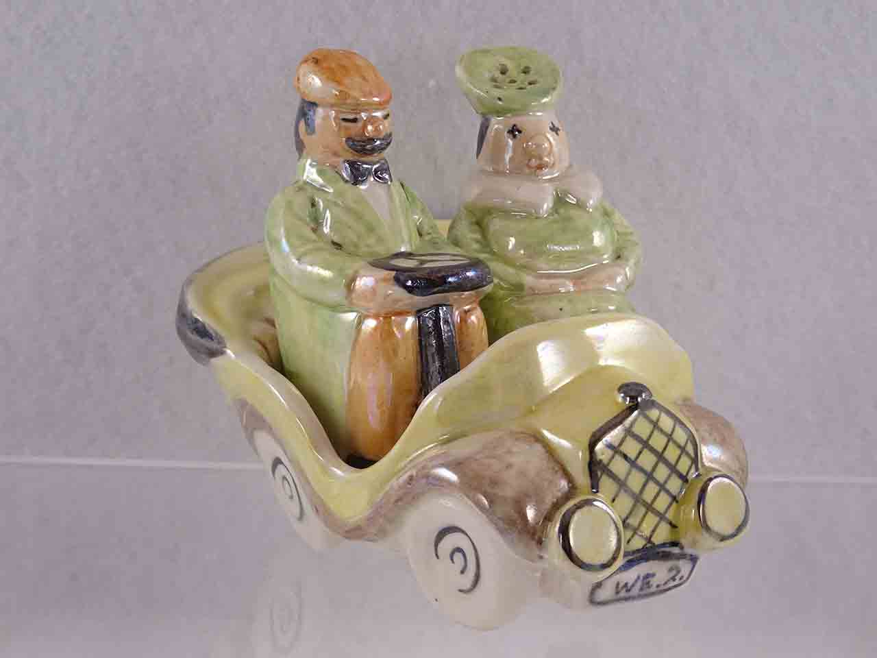 Lusterware man and woman in car salt and pepper shakers