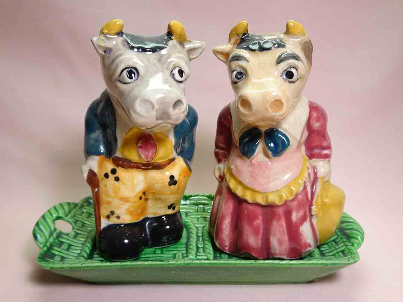 Dressed animal couples on green trays salt and pepper shakers - cows