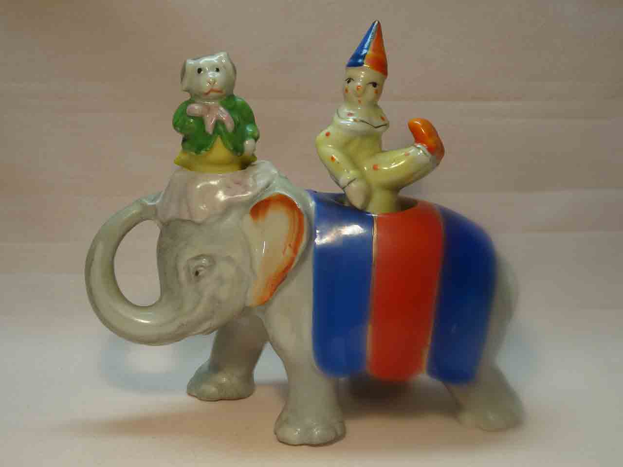 Walking elephant nodder with circus clown and dog as salt and pepper shakers