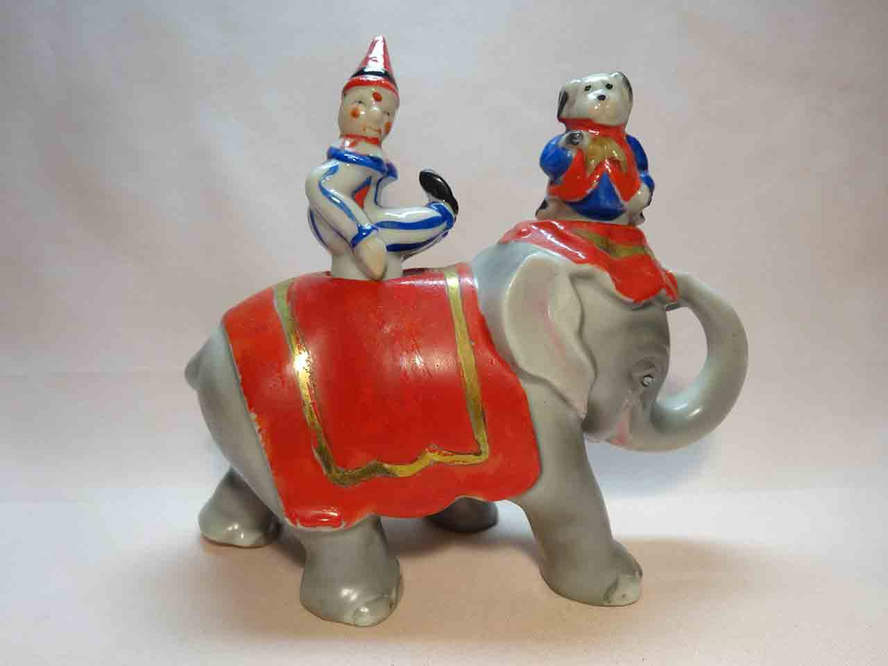 Walking elephant nodder with circus clown and dog as salt and pepper shakers