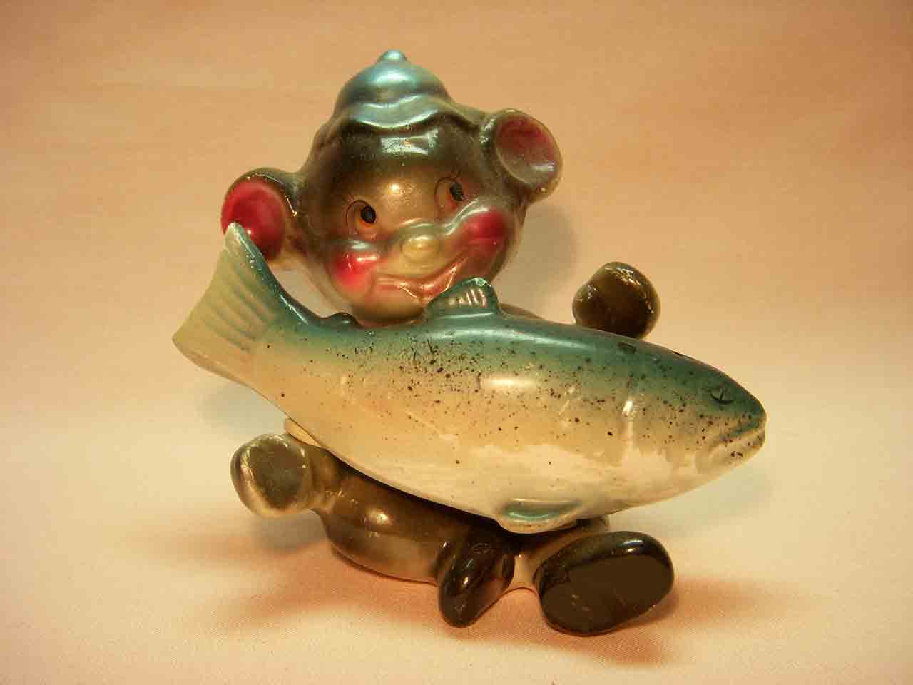Shiny anthropomorphic bear holding fish salt and pepper shakers